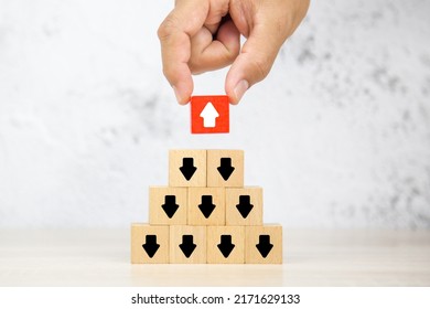 Hand Chooses Arrow Icon On Cube Wooden Block Stack With Pointing To Opposite Directions For Business Change Human Leadership And Strategy Management Concept.