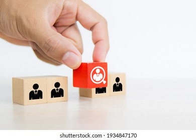 Hand Choosing People Icon On Cube Wooden Toy Block Stacked. Concepts Of Human Resources Personnel Selection And Person Organization Job Fit And Employees Performance.