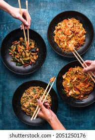 Hand With Chopsticks, Eating Asian Food, Top View. Chinese And Vietnamese Cuisine Set.