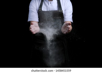 Hand Clap Of Chef With Flour On Black Back Isolated