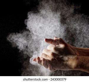 Hand Clap And White Flour On Black Background