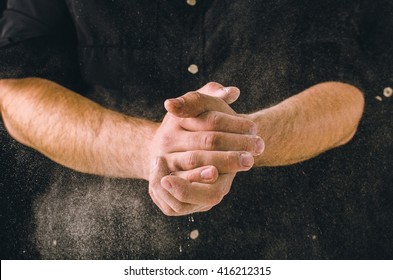 Hand Clap And White Flour On Black Background