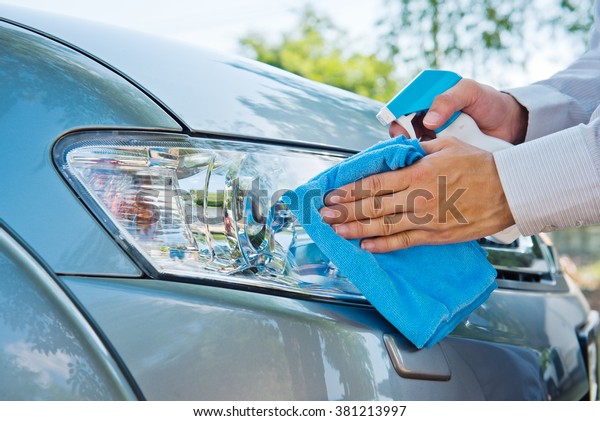 Hand\
cleaning car with microfiber cloth,wipe\
outside