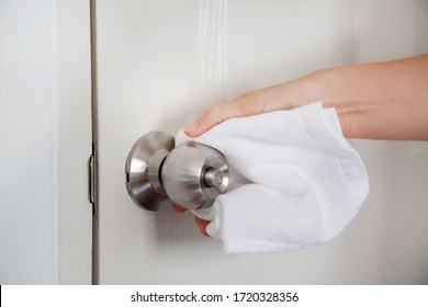 Hand Cleaning Door Knob To Avoid Infection