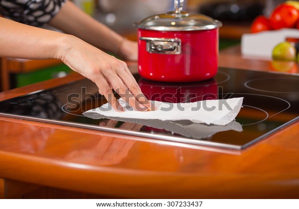 Hand Cleaning Induction Stove People Interiors Stock Image