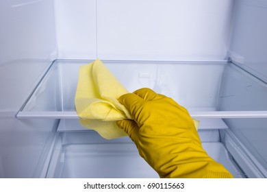 Hand Cleaning Refrigerator.