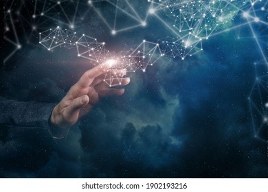 Hand clicks in the network of connections on the background of outer space.