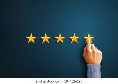 Hand of client giving a five star rating. Service rating, satisfaction concept - Shutterstock ID 1044526195