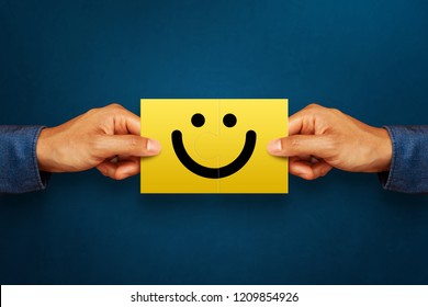 Hand Of Client Show A Feedback With Smile Face Card. Service Rating, Satisfaction Concept