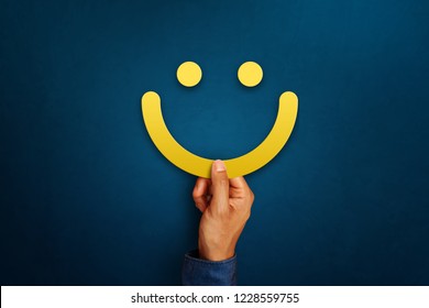 Hand Of Client Show A Feedback With Smiling Face Sign. Service Rating, Satisfaction Concept