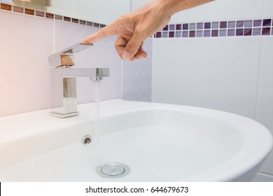 hand close water tap. Selective focus