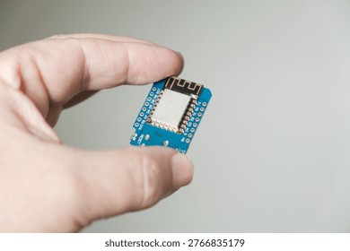 In hand, close-up of the ESP development board