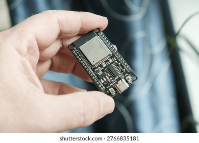 In hand, close-up of the ESP development board