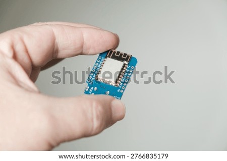 In hand, close-up of the ESP development board