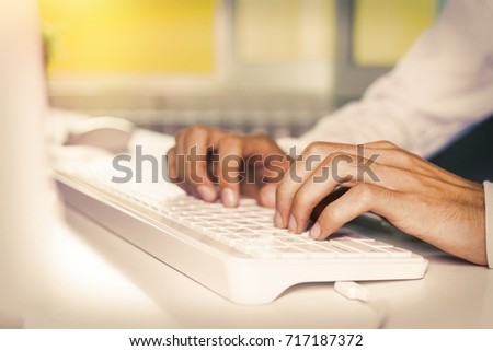 hand closeup typing on the computer