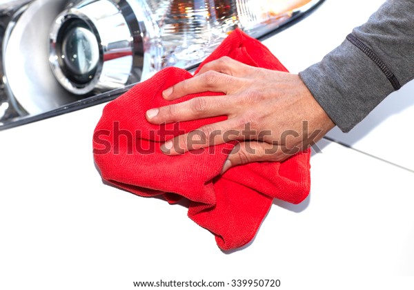 Hand with
cloth washing a car. Waxing and
polishing.