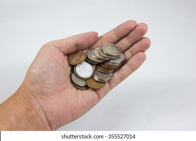 A Hand Of Coins In The Palm 