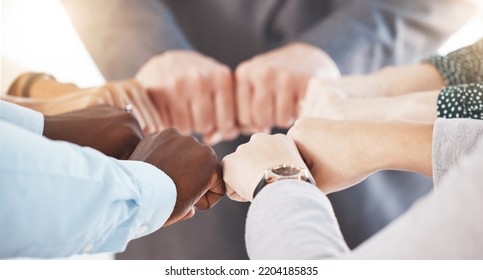 Hand, Collaboration And Motivation With The Hands Of A Business Team Together In A Huddle Or Circle. Teamwork, Goal And Target With An Employee Group Joining Their Fists In Trust, Solidarity Or Unity