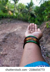 Hand With Colorful Glass Bangles 