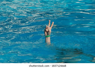 Hand Coming Out Of The Water, Victory Gesture