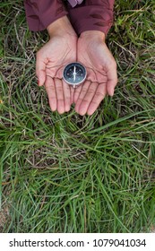 Hand with compass