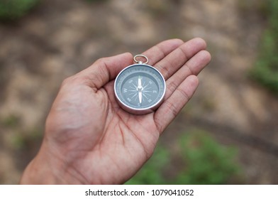 Hand with compass - Shutterstock ID 1079041052