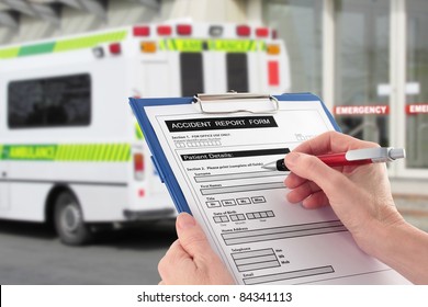Hand Completing an Accident Report Form by Ambulance