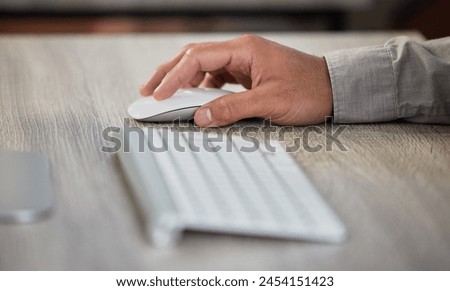 Hand, computer and mouse working in office for ecommerce business, online research and website browsing. Person, technology or pc searching internet for blog article, customer review or social media