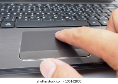 Hand Control On A Laptop Touchpad