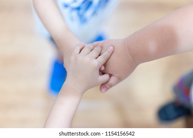 The hand coordination of childrens to show their unity and spirit.