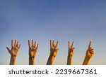 Hand countdown concept. Counting down on blue background. Gesturing number 5, 4, 3, 2, 1. Number five, four, three. two and one in sign language. Copy space for ad text. 
