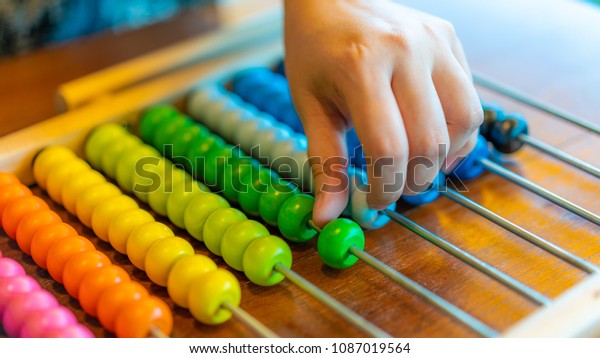 Hand Counts On\
Abacus