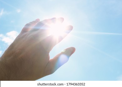 Hand covering the bright sun. Background. Texture. - Shutterstock ID 1794363352