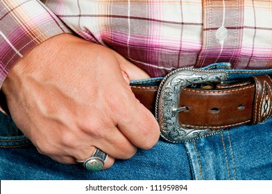 Hand of of Cowboy holding his belt
