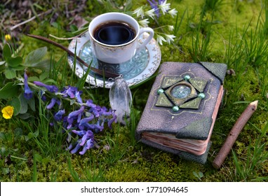 Hand Crafted Diary Book With Flowers, Crystal And Tea Cup In The Garden. Esoteric, Gothic And Occult Background With Magic Objects, Mystic And Fairy Tale Concept Outdoors.