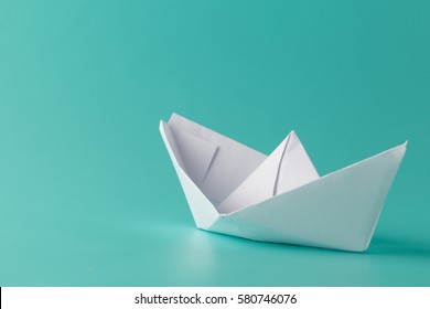 Hand Crafted Paper Boat On Aquamarine Background