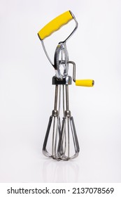 Hand Crank Egg Beaters With Yellow Handle.