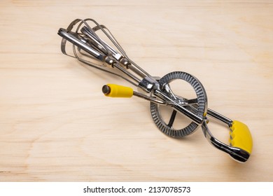 Hand Crank Egg Beaters With Yellow Handle.