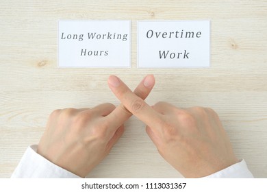 Hand Cross Mark Against Long Working Hours And Overtime Work