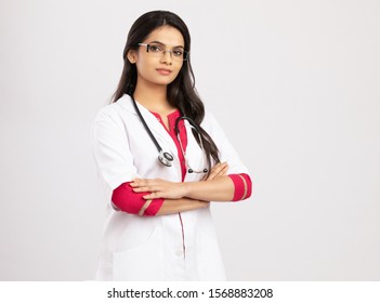 Hand Crossed Pretty Indian Young Female Doctor On White.