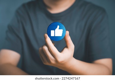Hand of customer picking Like button on Social media. The concept of Social media and digital online. Watch Live streaming and message, likes, emoji feedback, satisfaction, review, evaluation concept.
