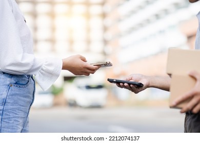 Hand Customer Using Digital Mobile Phone Scan QR Code Paying For Receive Parcel Post Box From Delivery Service Man At Door Home, Food Delivery, Digital Payment Technology And Online Shopping Concept.