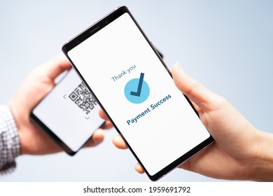 Hand of a customers with smartphone scanning QR Code payment from retailer. Cashless society, Contactless, Electronic wallet, Mobile app, Internet Technology, Smart solution, Digital money,  Close up.