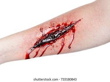 
A Hand Is Cut Vein A Lot Of Blood Flowing Red Body Wound Pain Suturing Wound Suicide Photo On White Background Professional Make-up Artist Draws Special Effects For Film Make-up