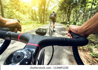 The Hand Of A Cyclist Is Climbing.