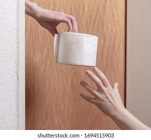 Hand Delivers Toilet Paper Through The Door