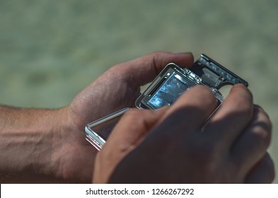 hand with digital action camera 