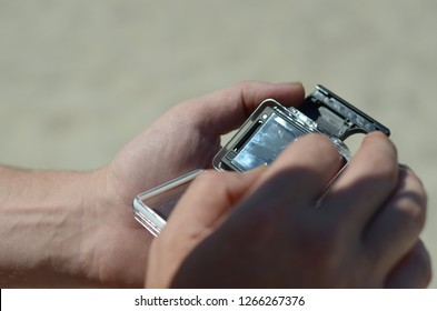 hand with digital action camera 