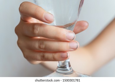 Hand With Dirty Nails Holding Empty Wine Glass 