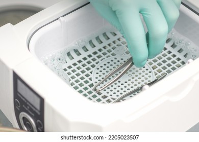 Hand Disinfects Tweezers With Cleaning Systems For Medical Instruments. Ultrasonic Cleaner